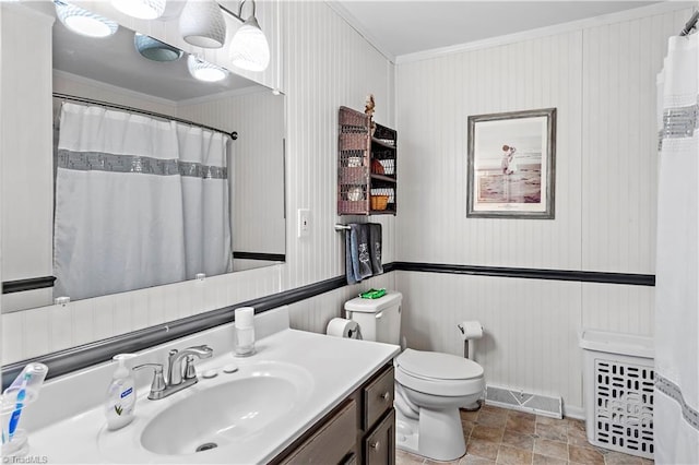 bathroom with ornamental molding, visible vents, vanity, and toilet