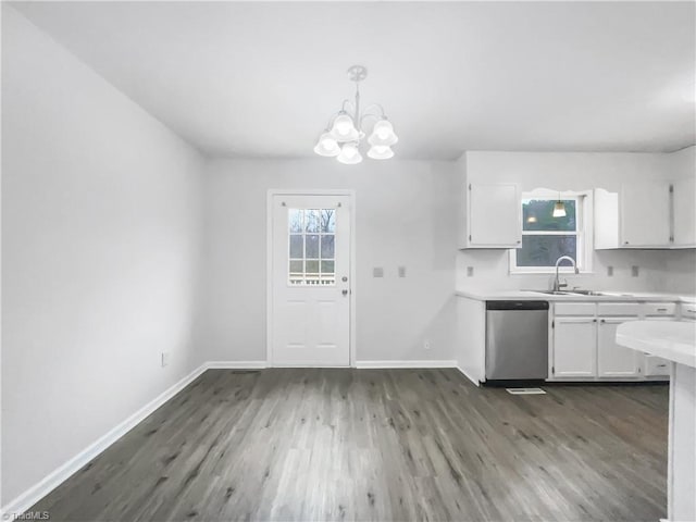 kitchen with white cabinets, light countertops, and stainless steel dishwasher