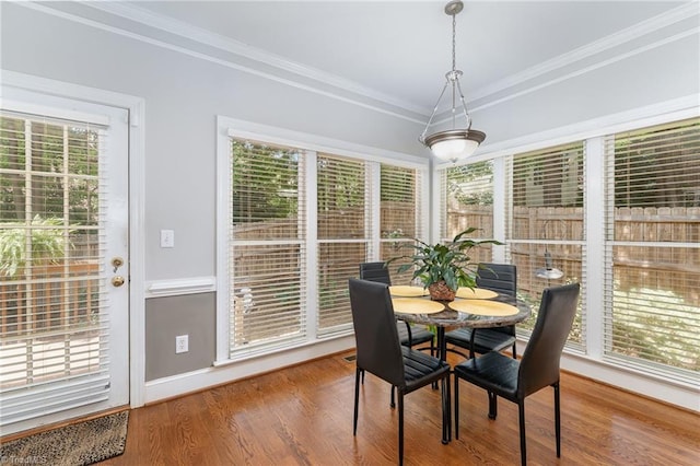4002 Hobbs Rd, Greensboro, NC 27410 - dining space with healthy amount of natural light, wood finished floors, and ornamental molding