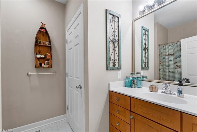 full bathroom featuring tile patterned floors, baseboards, a shower with curtain, and vanity