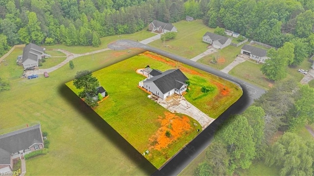 aerial view featuring a wooded view