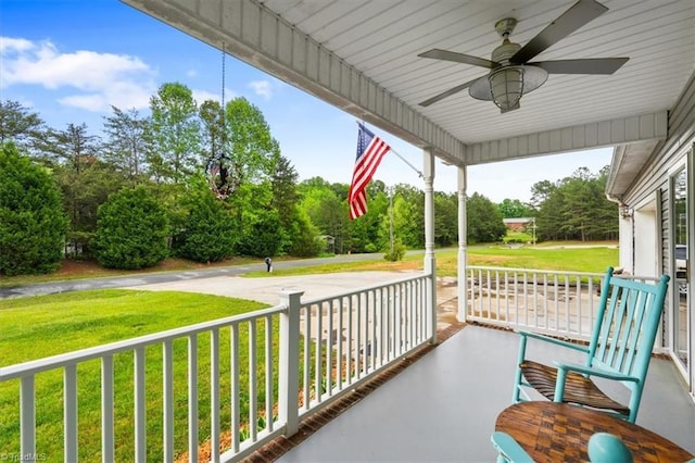 exterior space featuring covered porch and ceiling fan
