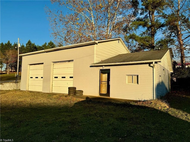 garage featuring a yard