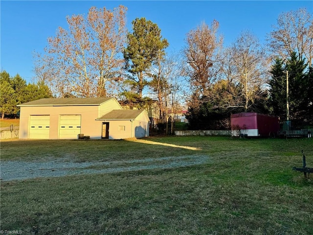 view of yard with a garage