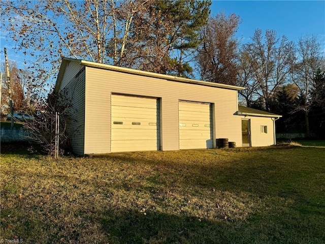 garage with a yard