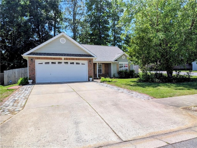 2309 Kasarda Dr, Greensboro, NC 27406 - single story home featuring a garage, concrete driveway, and brick siding