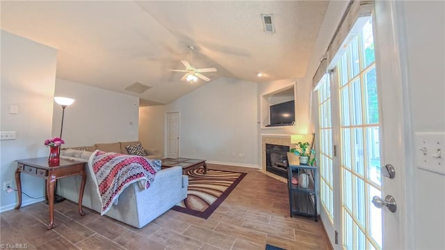 2309 Kasarda Dr, Greensboro, NC 27406 - living room featuring lofted ceiling, baseboards, a fireplace, and ceiling fan