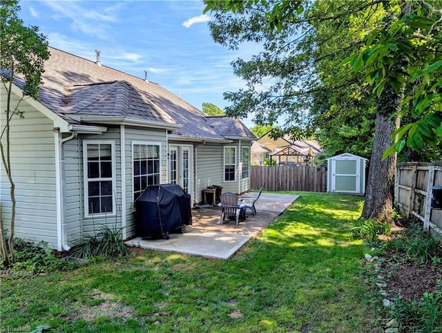 2309 Kasarda Dr, Greensboro, NC 27406 - rear view of property featuring a patio area and a shingled roof