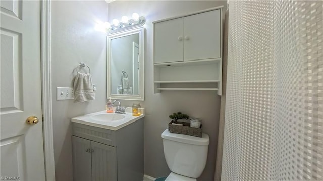 2309 Kasarda Dr, Greensboro, NC 27406 - bathroom featuring toilet, vanity, and a shower with shower curtain