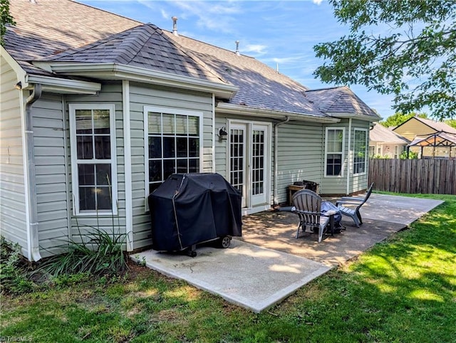 2309 Kasarda Dr, Greensboro, NC 27406 - back of property featuring a patio and roof with shingles