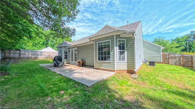 2309 Kasarda Dr, Greensboro, NC 27406 - rear view of house featuring a patio area and roof with shingles