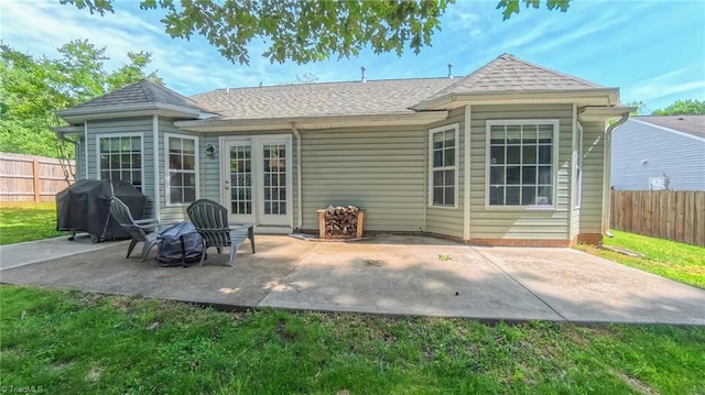 2309 Kasarda Dr, Greensboro, NC 27406 - back of house featuring roof with shingles and a patio