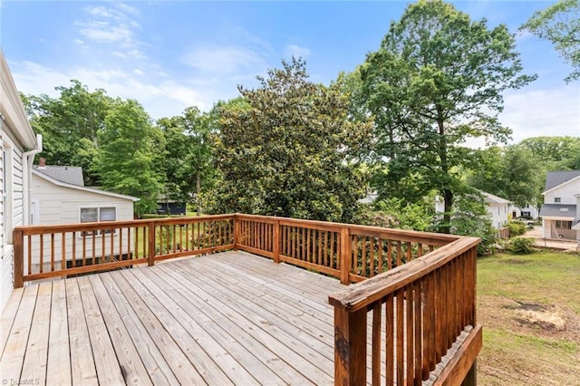 deck featuring view of wooded area
