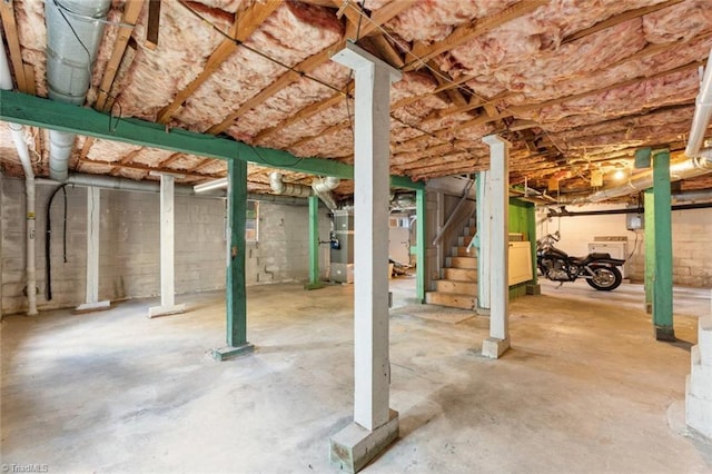 unfinished below grade area featuring stairway