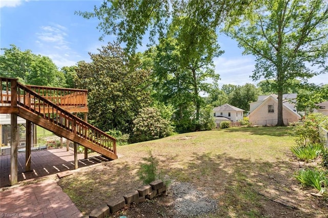 view of yard featuring stairway and a wooden deck