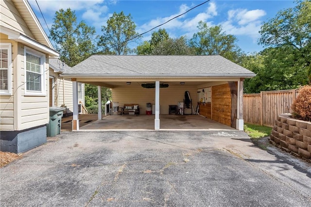 2606 Boone Trl, North Wilkesboro, NC 28659 - view of car parking featuring driveway, fence, and an attached carport