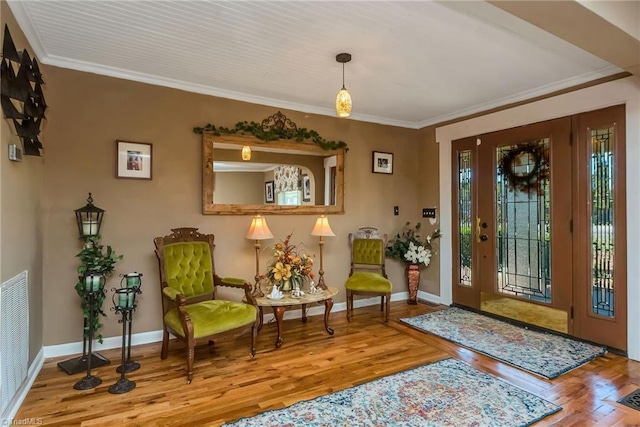2606 Boone Trl, North Wilkesboro, NC 28659 - entryway with wood finished floors, crown molding, and baseboards