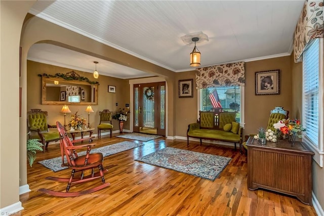 2606 Boone Trl, North Wilkesboro, NC 28659 - living area featuring healthy amount of natural light, arched walkways, wood finished floors, baseboards, and ornamental molding