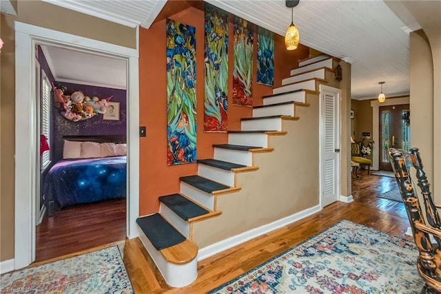 2606 Boone Trl, North Wilkesboro, NC 28659 - staircase featuring wood finished floors, baseboards, and crown molding