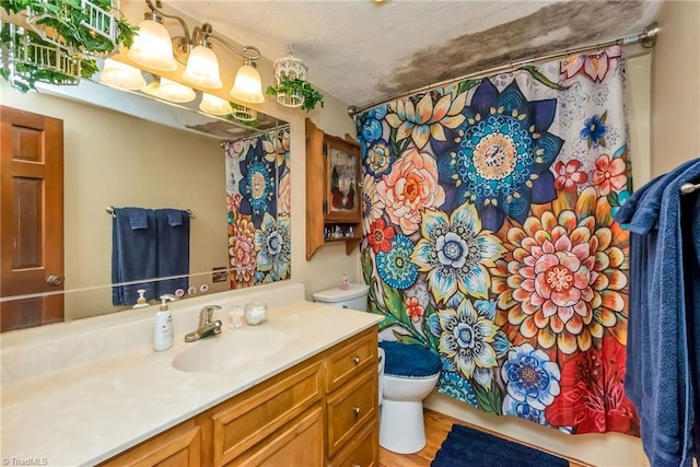 2606 Boone Trl, North Wilkesboro, NC 28659 - full bath with toilet, vanity, and wood finished floors
