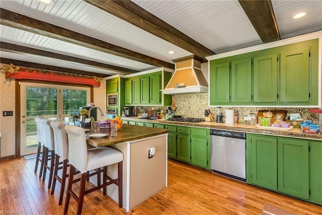 2606 Boone Trl, North Wilkesboro, NC 28659 - kitchen featuring stainless steel appliances, premium range hood, green cabinets, light wood-style flooring, and tasteful backsplash