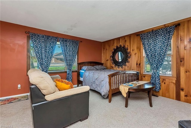 2606 Boone Trl, North Wilkesboro, NC 28659 - carpeted bedroom featuring wooden walls and multiple windows