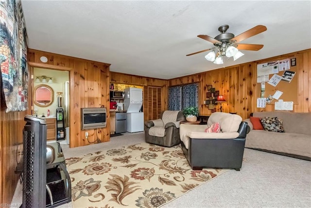 2606 Boone Trl, North Wilkesboro, NC 28659 - living area featuring light colored carpet, wooden walls, a ceiling fan, and heating unit