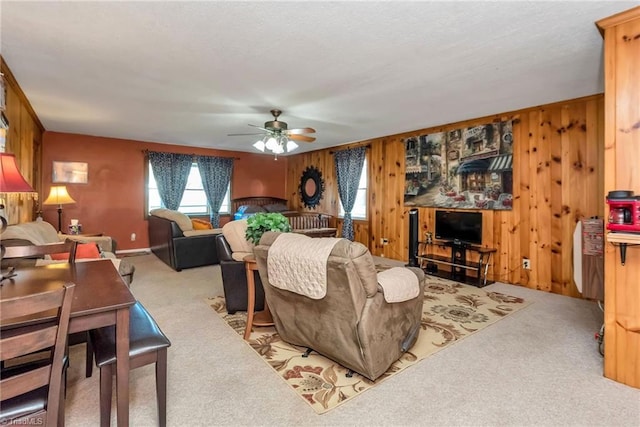 2606 Boone Trl, North Wilkesboro, NC 28659 - living room featuring carpet flooring, ceiling fan, and wooden walls