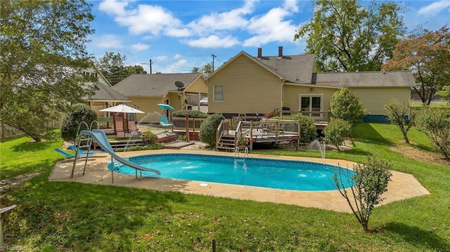 2606 Boone Trl, North Wilkesboro, NC 28659 - swimming pool with a water slide, a wooden deck, and a yard