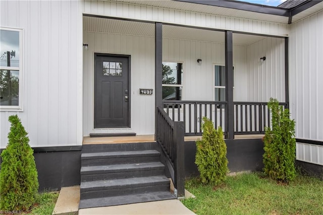 doorway to property featuring a porch