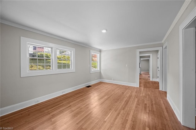 unfurnished bedroom featuring crown molding, multiple windows, light wood-style flooring, baseboards, and recessed lighting