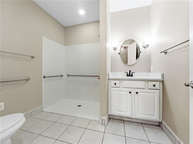 bathroom featuring walk in shower, tile patterned flooring, vanity, and toilet