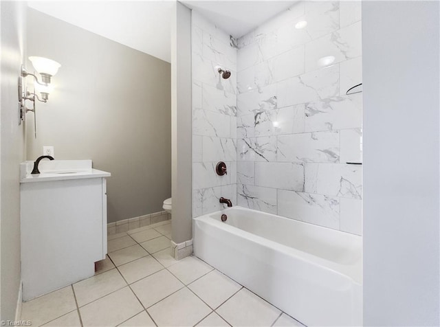 full bathroom with toilet, tile patterned floors, vanity, and tiled shower / bath combo