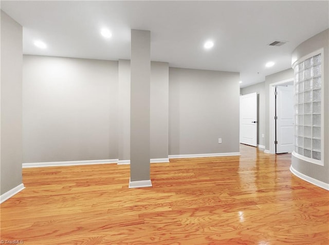 basement featuring light hardwood / wood-style floors