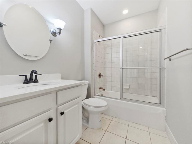 full bathroom featuring tile patterned floors, vanity, enclosed tub / shower combo, and toilet