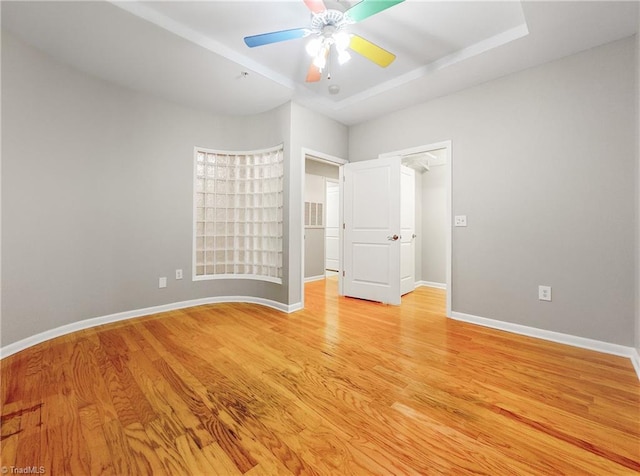 unfurnished bedroom with light hardwood / wood-style flooring and ceiling fan