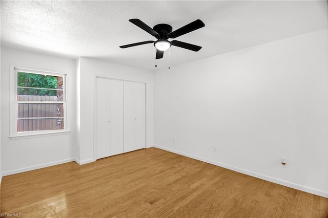 3114 Rockingham Rd, High Point, NC 27265 - unfurnished bedroom with wood finished floors, a closet, and ceiling fan