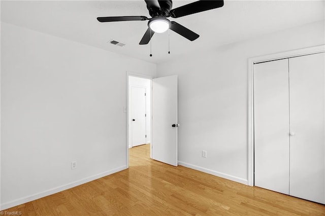 3114 Rockingham Rd, High Point, NC 27265 - unfurnished bedroom with light wood-type flooring, a closet, and a ceiling fan