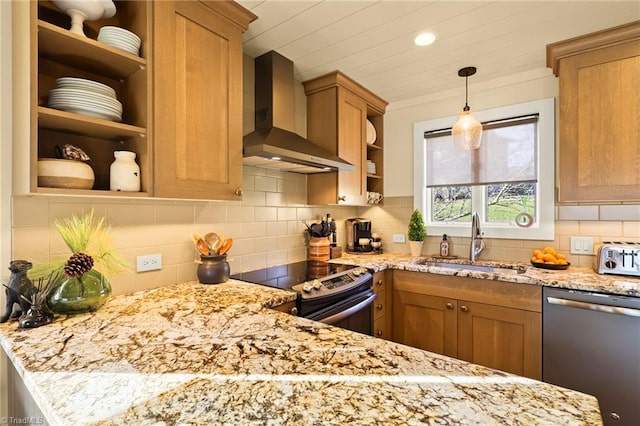 kitchen featuring sink, light stone counters, wall chimney range hood, and stainless steel appliances