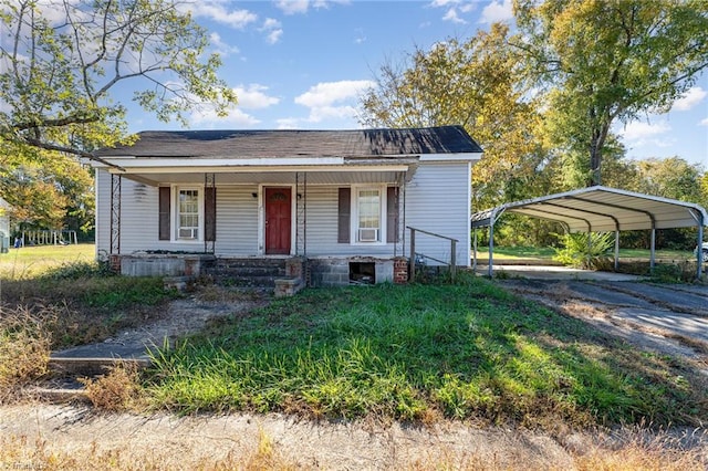 view of front of house with covered porch and a carport