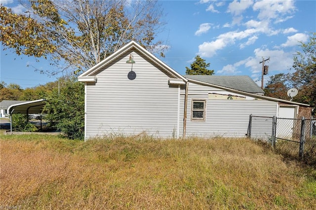 view of home's exterior featuring a carport