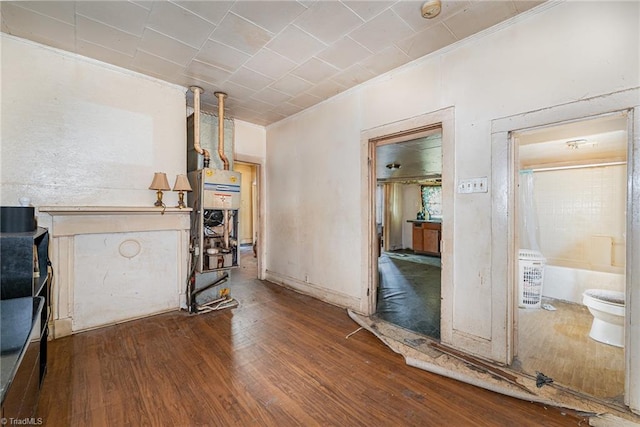 interior space featuring crown molding and wood-type flooring