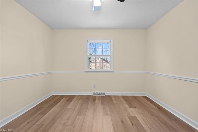 unfurnished room featuring light hardwood / wood-style floors