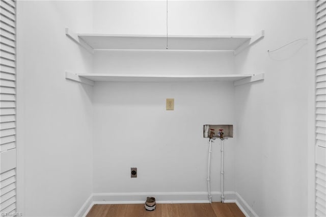 laundry room with washer hookup, wood-type flooring, and electric dryer hookup