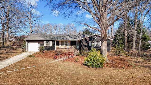 ranch-style home featuring a garage and a porch