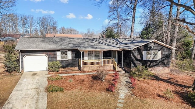 ranch-style home with a porch and a garage