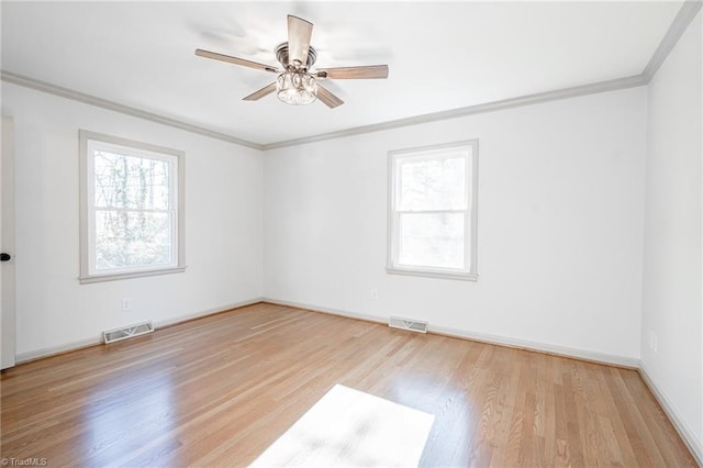 unfurnished room with ceiling fan, light hardwood / wood-style flooring, and crown molding