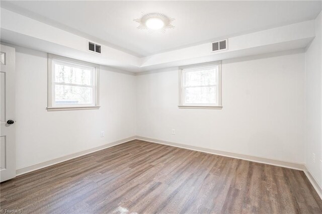 spare room with hardwood / wood-style floors