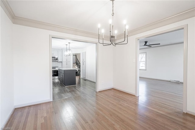 unfurnished dining area featuring ceiling fan, wood-type flooring, and ornamental molding