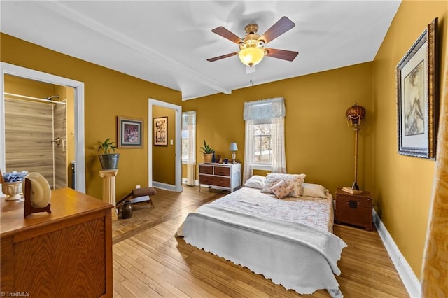 bedroom with light wood-style floors, baseboards, and a ceiling fan